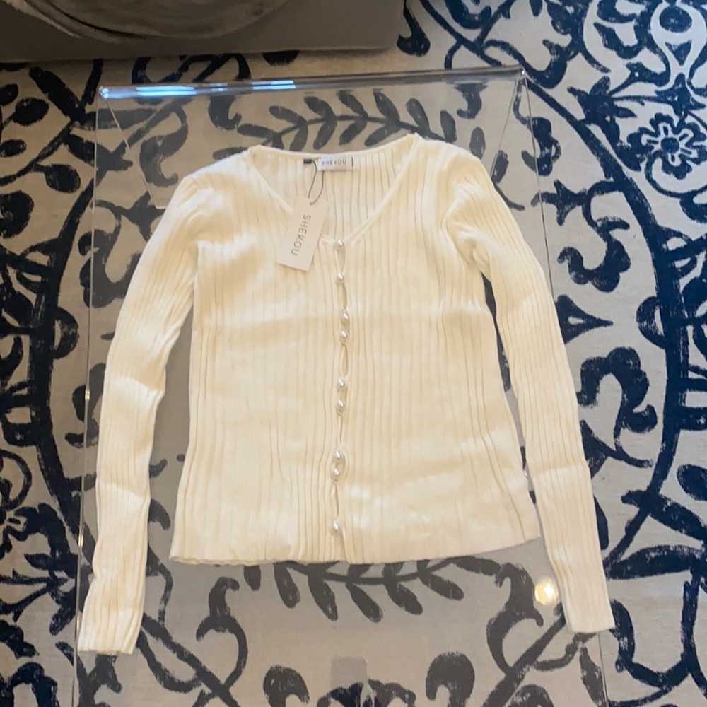 Cardigan with pearl buttons in beige